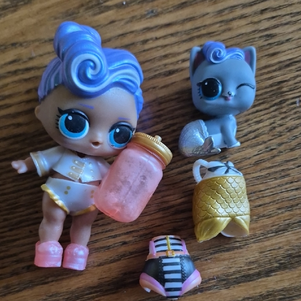 L.O.L. Surprise! Doll with Purple Hair, Pink Bottle & Gold Outfit Accents